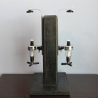 Vintage-style beer dispenser with wooden finish on a plain background