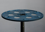 Blue gear wheel on a gray background