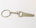 Metal keychain with saw blade design on a white background