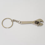 Metal wrench keychain on a white background