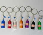 Set of colorful NOS bottle keychains on a white background