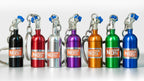 Set of colorful NOS (Nitrous Oxide Systems) canisters on a white background