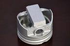 Metal piston on a dark background
