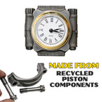 Clock made from recycled piston components with text on a white background