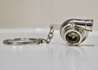 Turbocharger keychain on a white surface