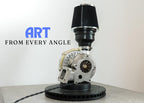 Turbocharger art piece with 'ART FROM EVERY ANGLE' text on a white background