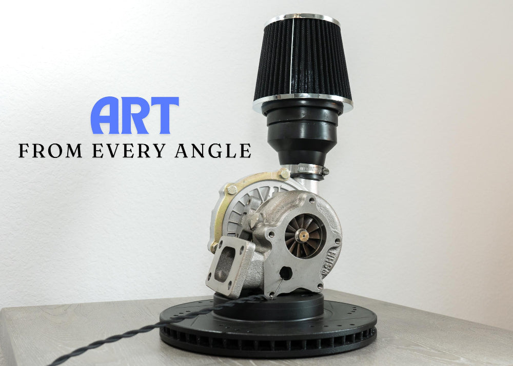 Turbocharger art piece with 'ART FROM EVERY ANGLE' text on a white background