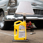 Automotive desk oil lamp combining functional lighting with mechanical design.