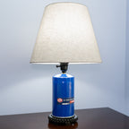 Automotive oil filter light made from real parts, offering functional lighting with classic muscle car appeal.