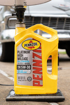 Automotive oil lamp decor featuring real Pennzoil container and polished wood base.