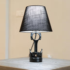 Automotive piston lamp paired with a black lampshade, creating a clean and modern lighting piece with subtle car-inspired style.