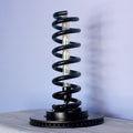 Automotive spring lamp made from real car components, blending industrial design with functional interior lighting.