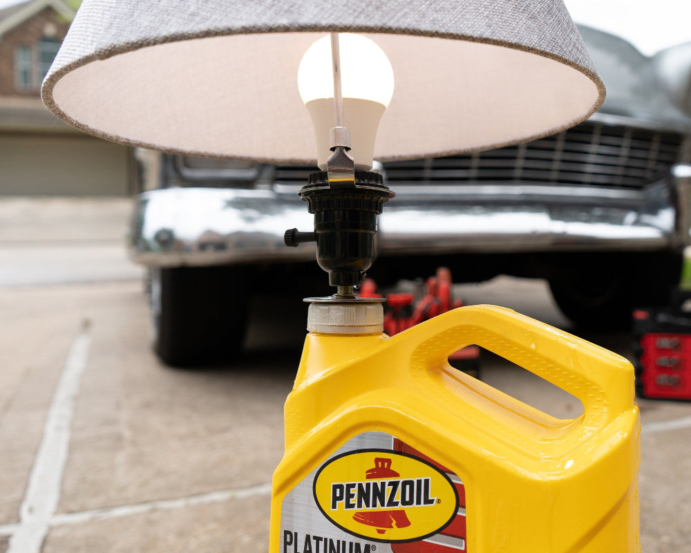 Garage lighting lamp with motor oil theme designed for automotive enthusiasts.