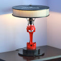 Car parts lamp made from real car parts, featuring an upcycled brake rotor and piston with a sandblasted metal finish for automotive decor.
