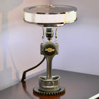 Chevy piston lamp made from real car parts, featuring an upcycled piston and gear with a durable sandblasted metal finish.