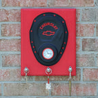 Decorative wall mount with Chevrolet logo on a brick wall