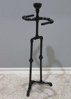 Decorative toilet paper stand that combines storage with functional design.