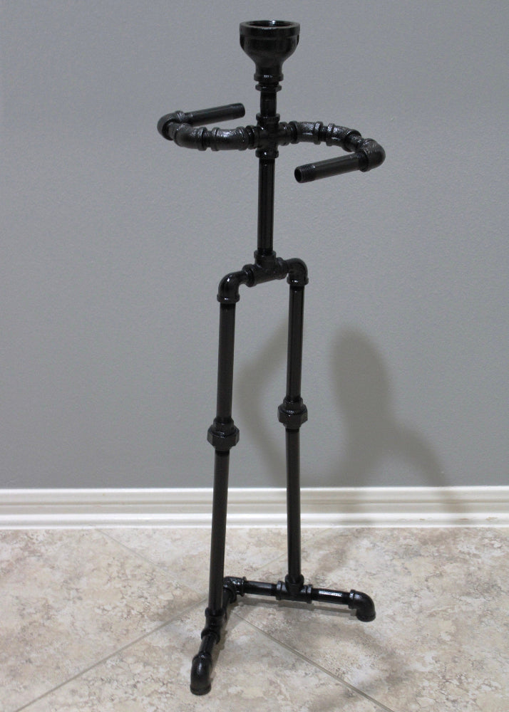Decorative toilet paper stand that combines storage with functional design.