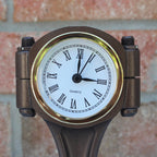 Engine piston clock display designed for desks garages or workspaces with built in storage compartments.