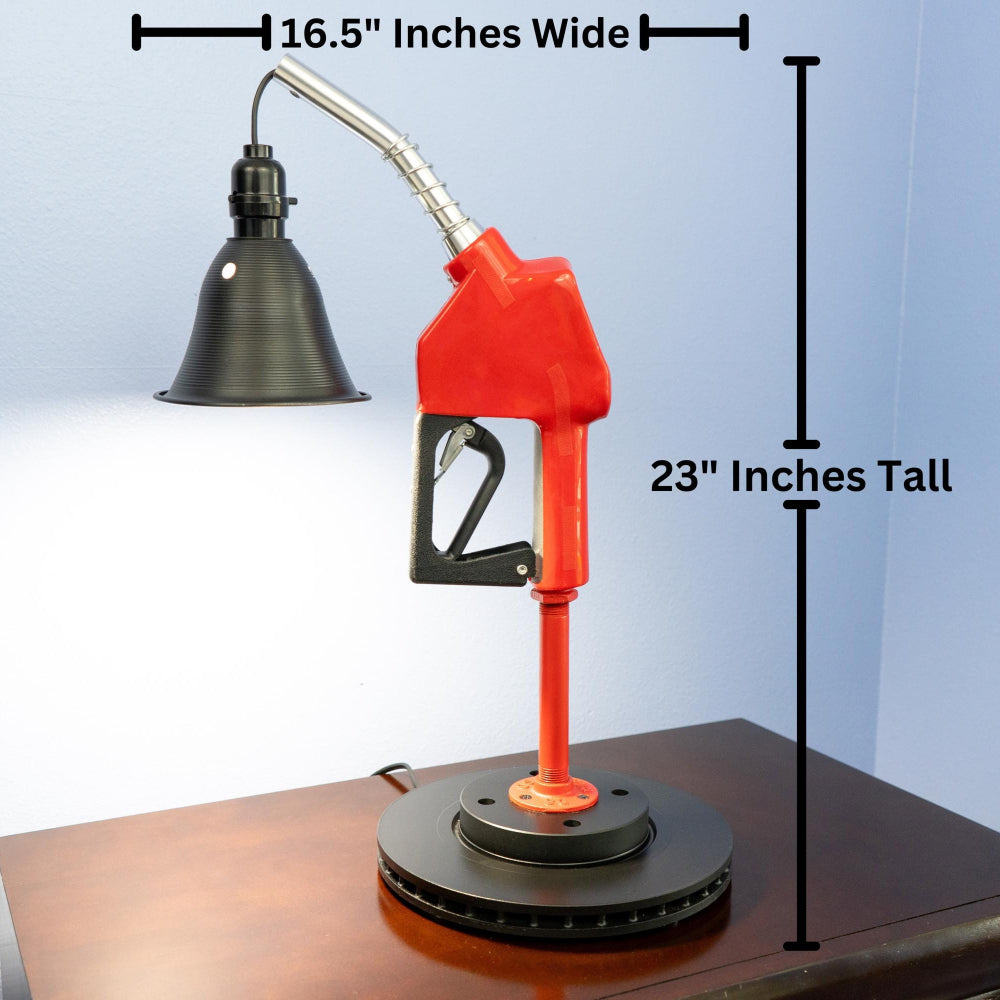 Gas station style nozzle lamp repurposed into a modern lighting piece with nostalgic mechanical character.