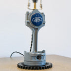 Genuine Ford piston lamp crafted from an original engine component, offering clean industrial style with real brand heritage.