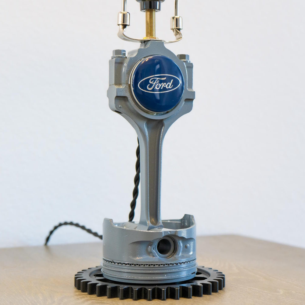 Genuine Ford piston lamp crafted from an original engine component, offering clean industrial style with real brand heritage.