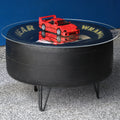 Goodyear NASCAR tire table handcrafted from an authentic race used tire, featuring durable construction and bold motorsports style.