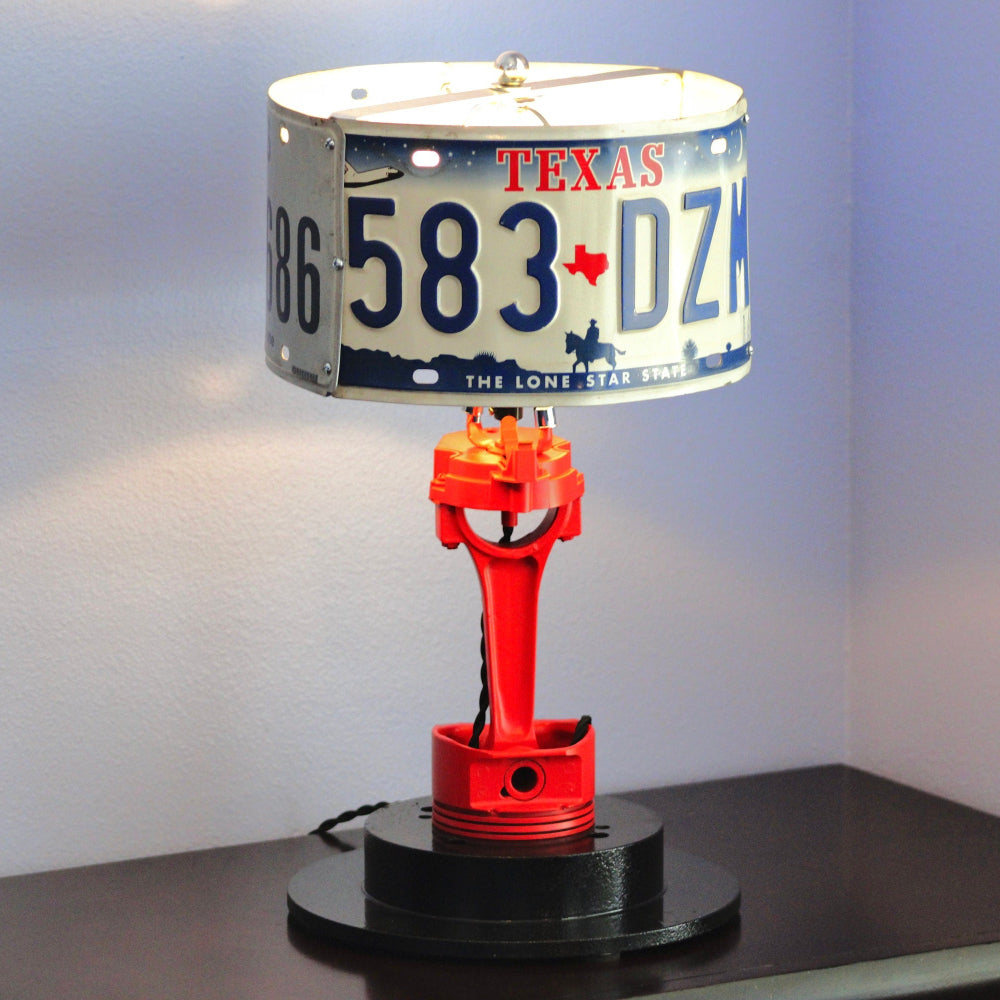 Handcrafted car parts lamp made from real automotive components, offering one-of-a-kind metal lighting with authentic car enthusiast appeal.
