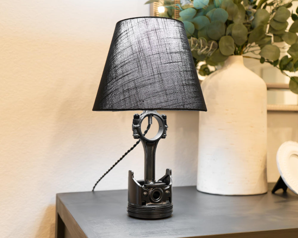 Handcrafted piston lamp built from real automotive components, designed to complement modern and industrial interiors.