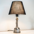 Modern piston lamp that blends clean minimalist design with real engine part detailing for understated car inspired decor.