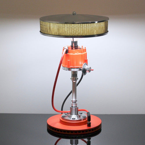 Muscle car distributor lamp inspired by classic performance vehicles, handcrafted from authentic automotive components.