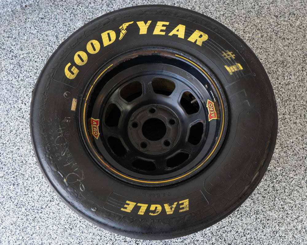 NASCAR wheel and tire table built from authentic racing components, offering unique automotive furniture with racing character.