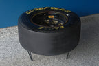 One-of-a-kind NASCAR tire table handcrafted from a retired racing tire, offering unique motorsports furniture appeal.