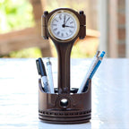 Piston clock made from real engine piston with built in storage and quartz time display for automotive desk decor.