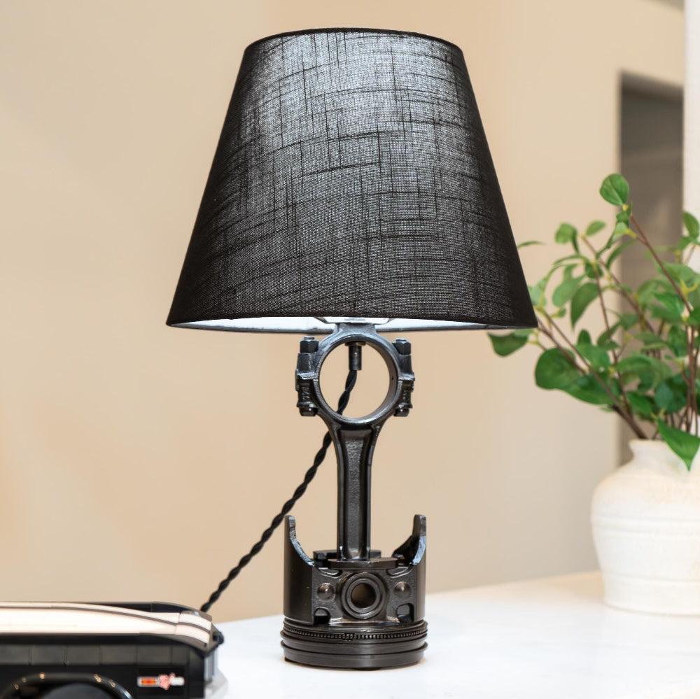 Piston lamp made from a real upcycled car piston, crafted as subtle automotive decor with a clean, home-friendly design.