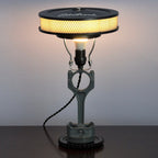 Piston lamp featuring a Chevy logo centerpiece, made from real car parts and designed for automotive themed spaces.