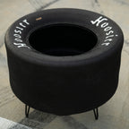Racing tire table used as home decor, crafted from an authentic Hoosier tire for motorsports-inspired interiors.