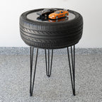 Recycled tire bar height table designed with industrial automotive style, combining real tire material with a functional table surface.
