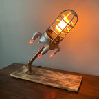 Silver rocket night lamp with flicker lighting effects for fun and imaginative room lighting.