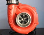 Turbocharger lamp made from real car parts, handcrafted with metal automotive components and functional lighting for garages and offices.