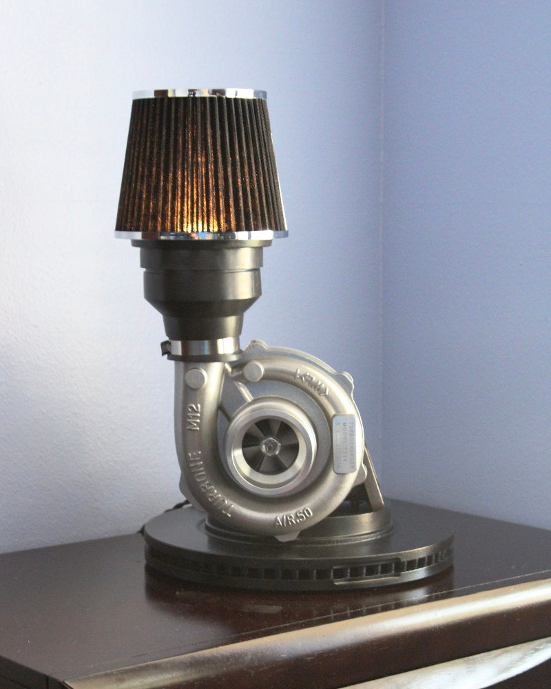 Turbocharger lamp made from real car parts, designed as statement automotive decor for home, garage, or office spaces.