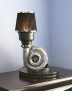 Turbocharger lamp made from real car parts, designed as statement automotive decor for home, garage, or office spaces.