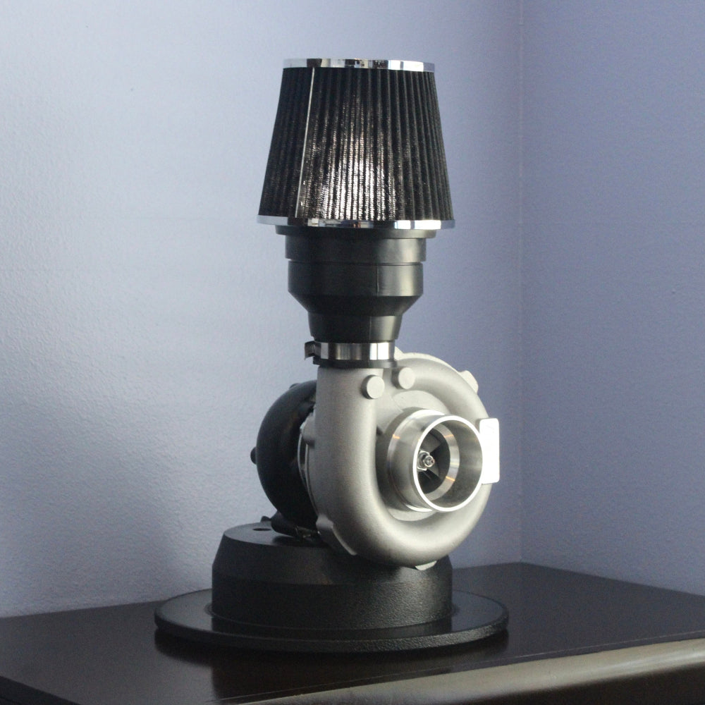 One-of-a-kind turbocharger lamp made from real car parts, combining automotive craftsmanship with durable metal lighting decor.