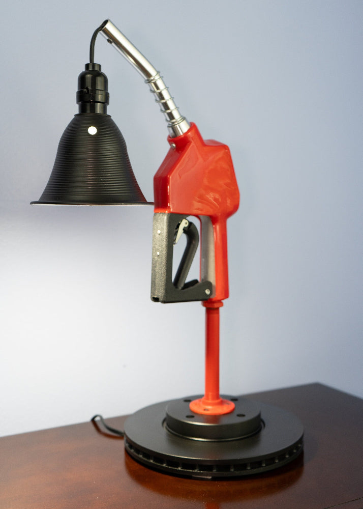 unique red gas pump nozzle lamp handcrafted from real automotive parts with unique character.