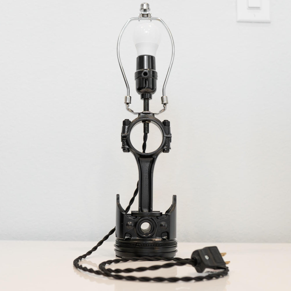 unique piston lamp handcrafted from a real car piston, combining automotive craftsmanship with everyday home lighting.