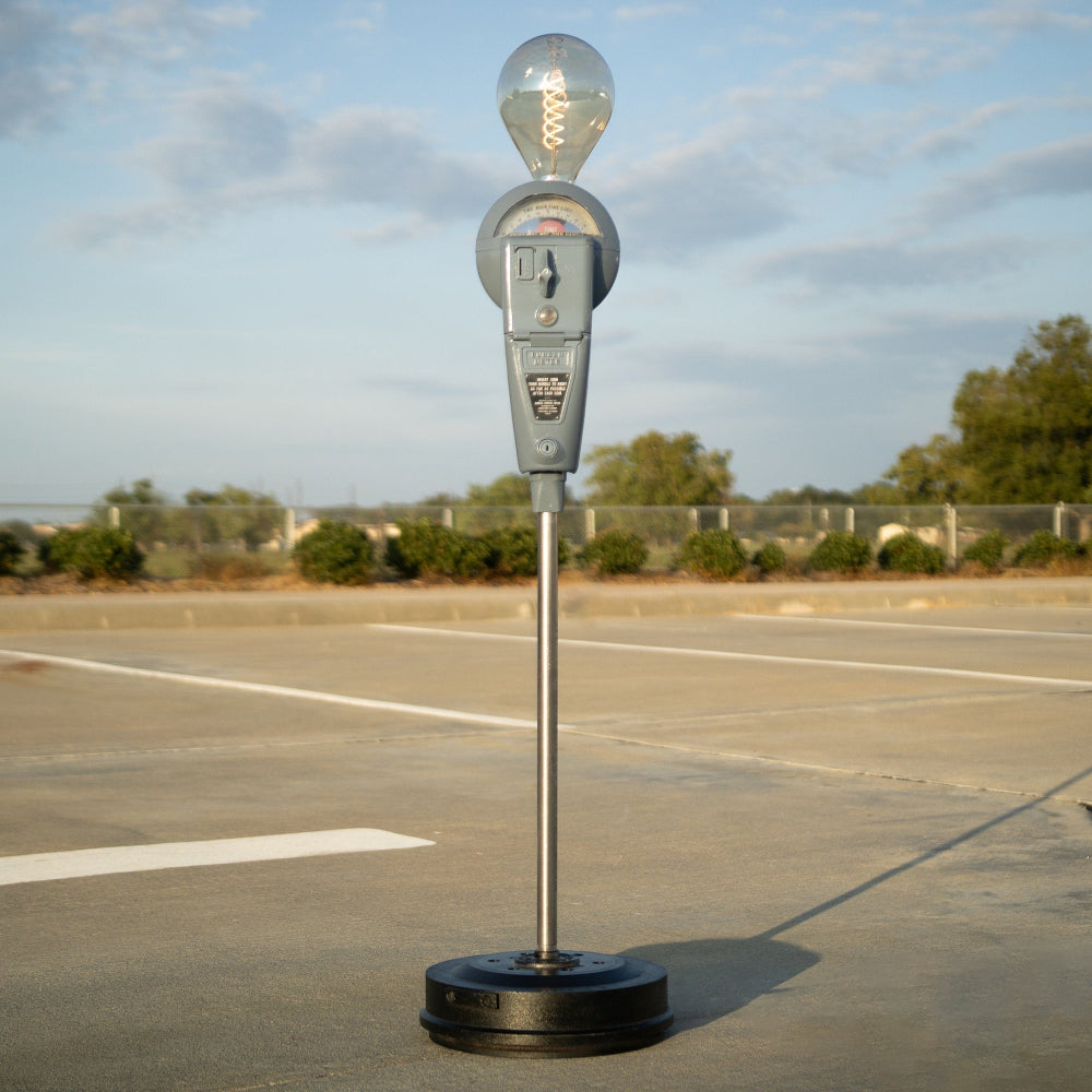 Vintage parking meter floor lamp made from real street meter with functional lighting.